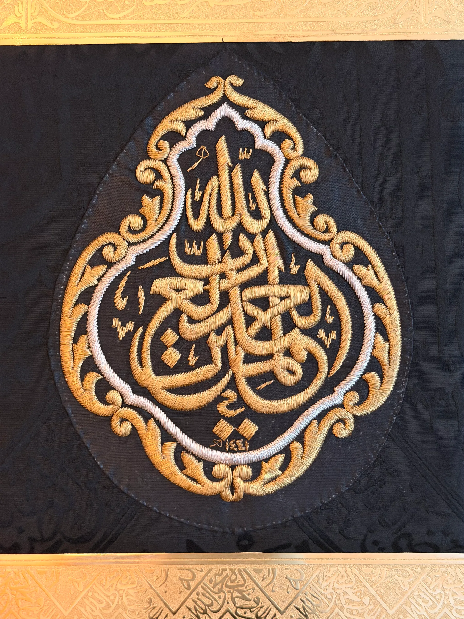 Macro of the Kiswah embroidery in gold and silver thread on black silk